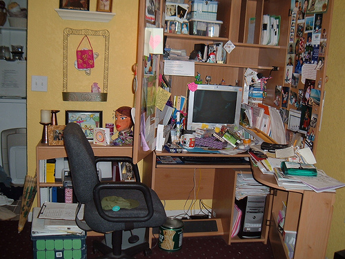 A messy working place where the principle of clutter control should be applied.